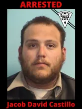 A New Mexico State Police mugshot of a man with short brown hair and a beard. The image features a black border with the word 'ARRESTED' in large red text at the top, a New Mexico State Police badge in the upper right corner, and the name 'Jacob David Castillo' in large red text at the bottom.