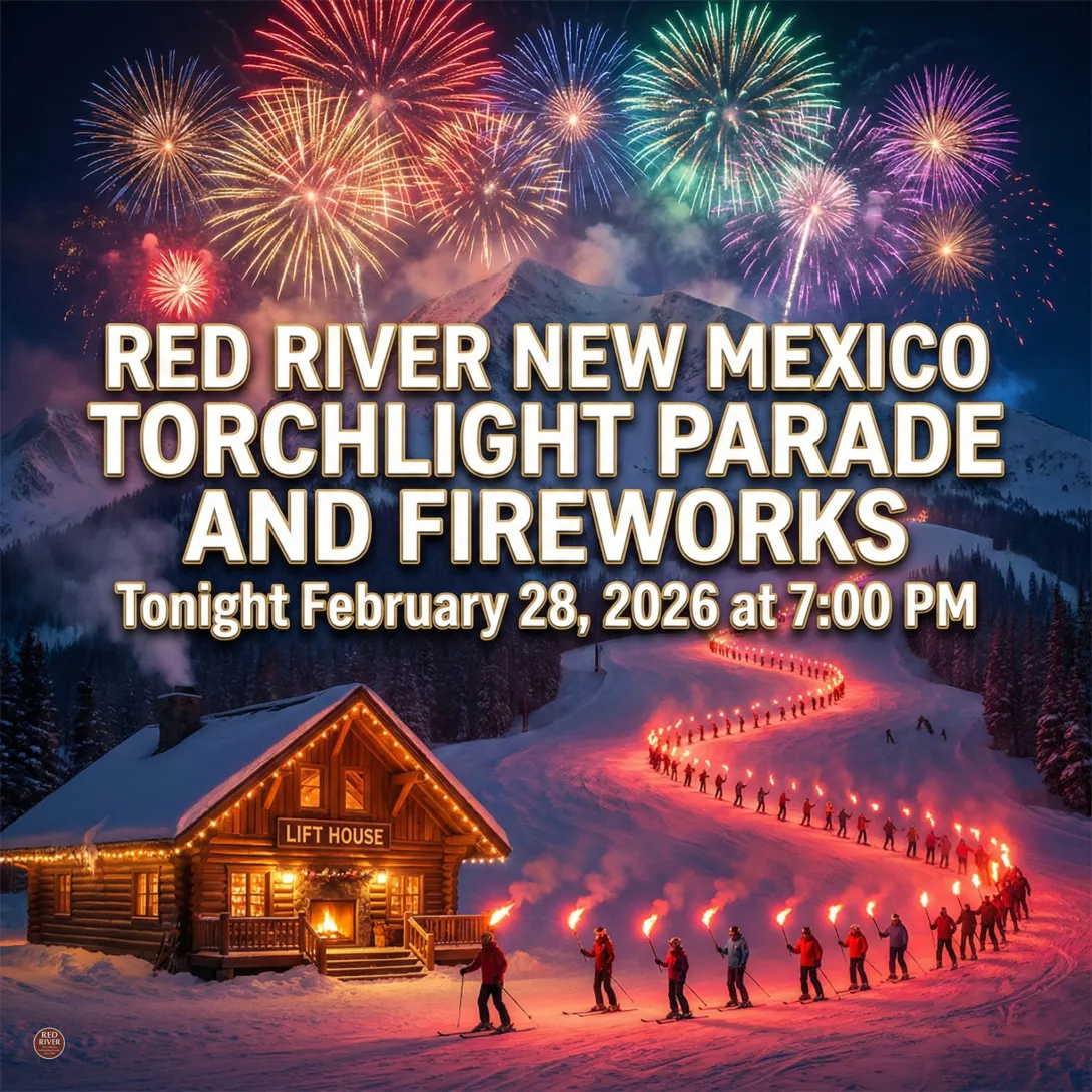 A vibrant square promotional graphic showing a snowy mountain landscape at night under a spectacular display of colorful fireworks. A rustic, warmly lit log cabin with a sign "LIFT HOUSE" and string lights sits in the lower left. A long, serpentine trail of skiers in red jackets, all holding burning torches, descends the winding slope to the right. Large, bold white text with a gold outline is centered at the top, reading: "RED RIVER NEW MEXICO TORCHLIGHT PARADE AND FIREWORKS," with smaller white text below
